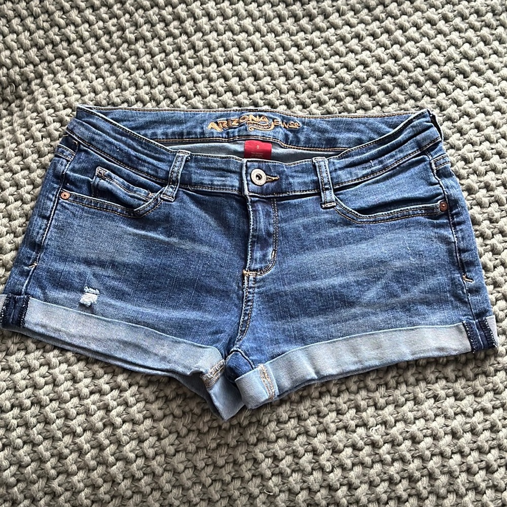 Arizona Jean Co.. medium wash low-rise jean shorts.